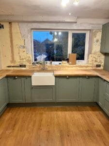 Kitchen installation Cambridge – sage green shaker kitchen with butler sink and oak worktops